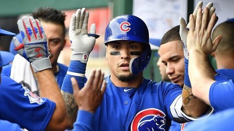 A bunt by Javier Baez on a high pitch provided the Cubs with the winning run against the Nationals. (Photo Credit: Brad Mills-USA TODAY Sports)