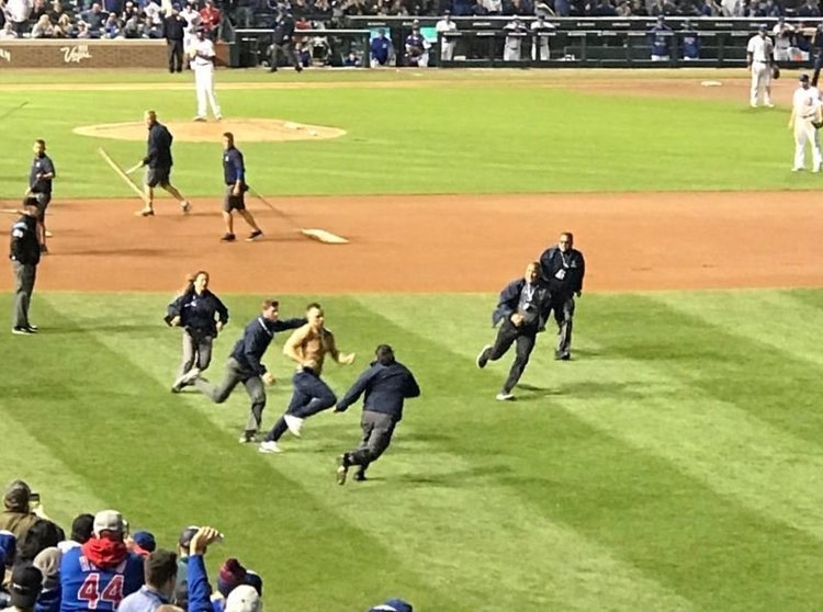 WATCH Shirtless Cubs fan runs onto field, gets tackled by security
