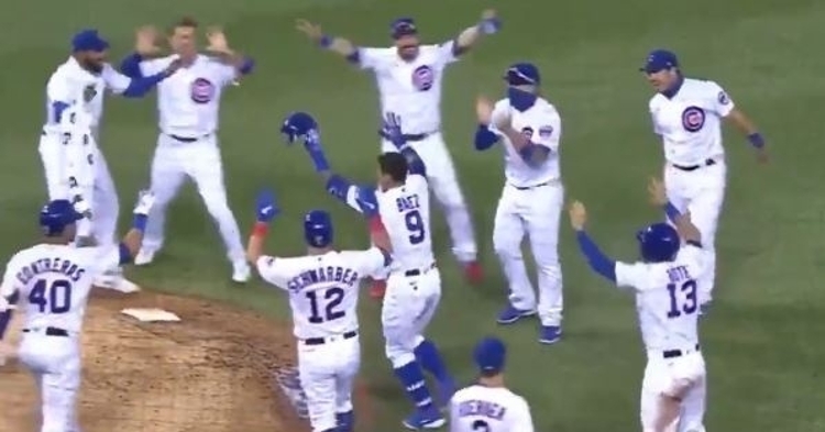 A socially distanced infield celebration followed Javier Baez's walkoff single.