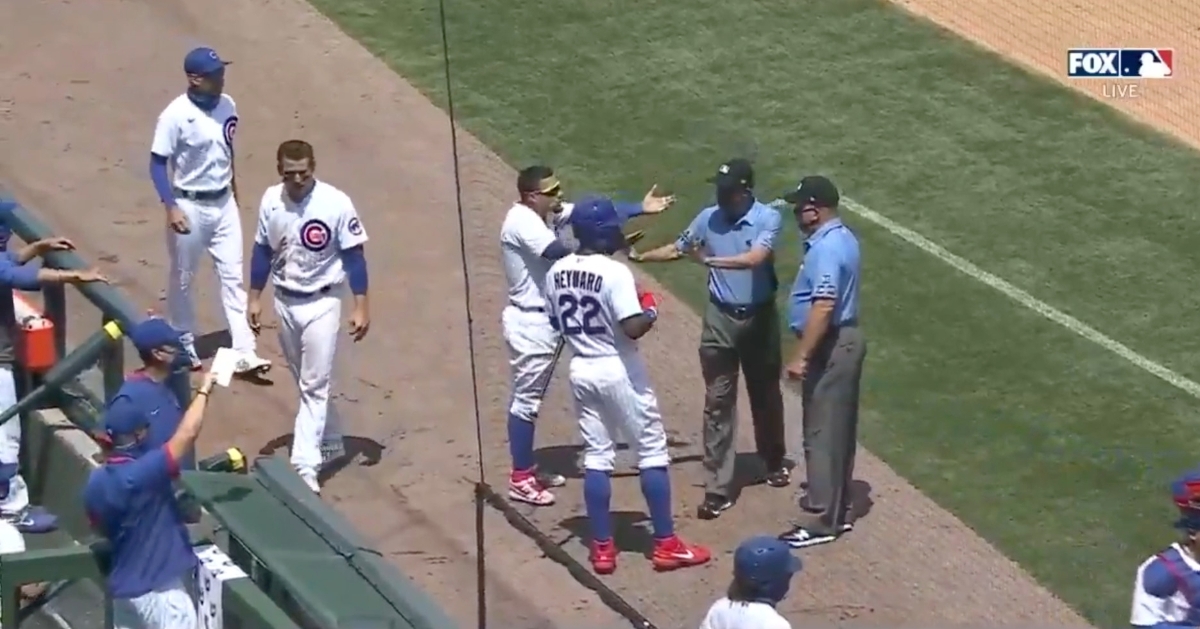 WATCH Cubs bark at Brewers' dugout, have to be held back by umpires