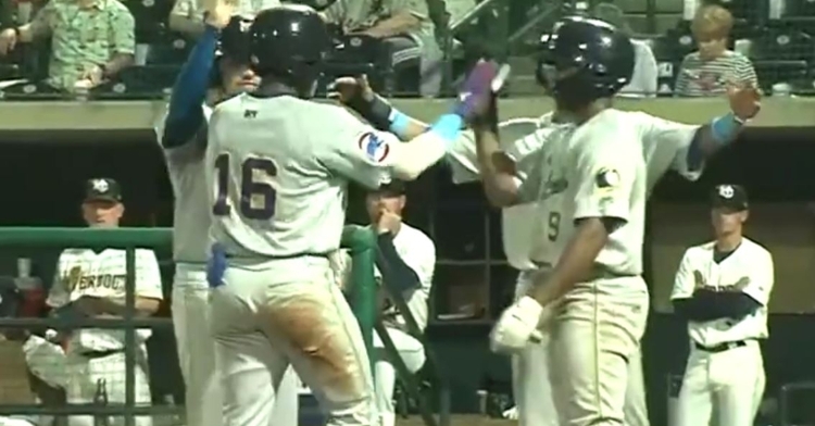 Made celebrates with his teammates after his first homer