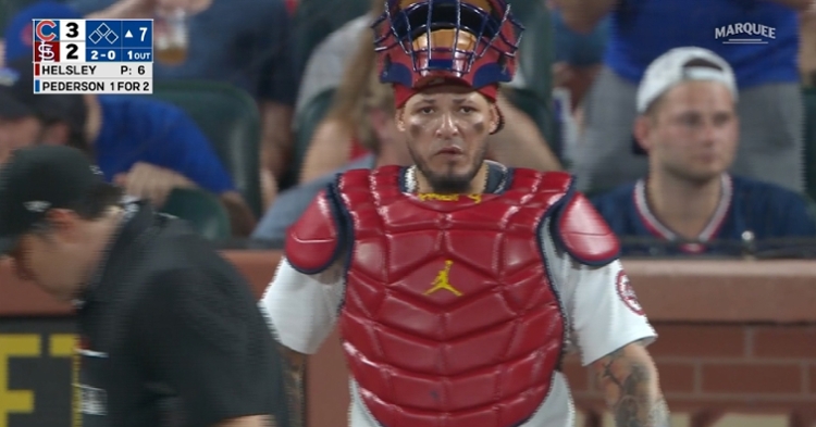 Yadier Molina's off-the-mark throw to third base proved costly for the Cardinals. (Credit: @WatchMarquee on Twitter)