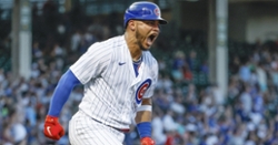 Chicago Cubs first baseman Derrek Lee (25) watches as the ball sails foul  down the right field line during the game between the Houston Astros and  Chicago Cubs at Wrigley Field in