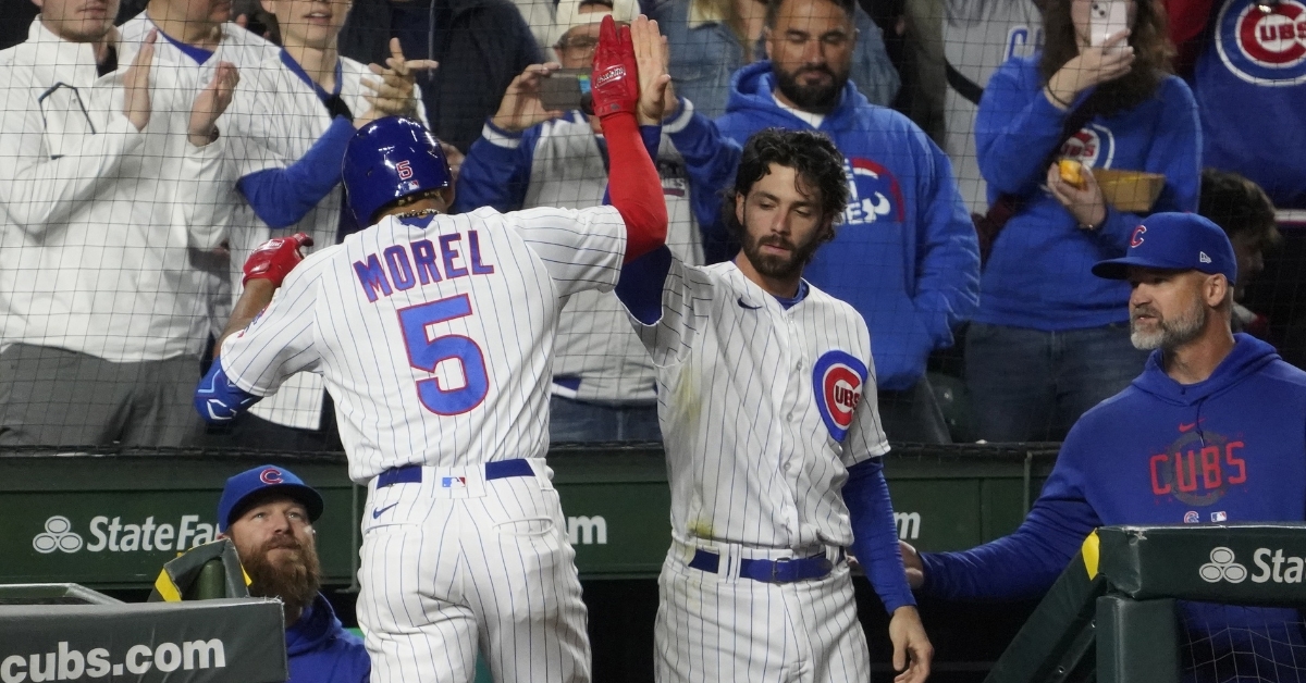 Chicago Cubs and the St. Louis Cardinals walk out into London Stadium