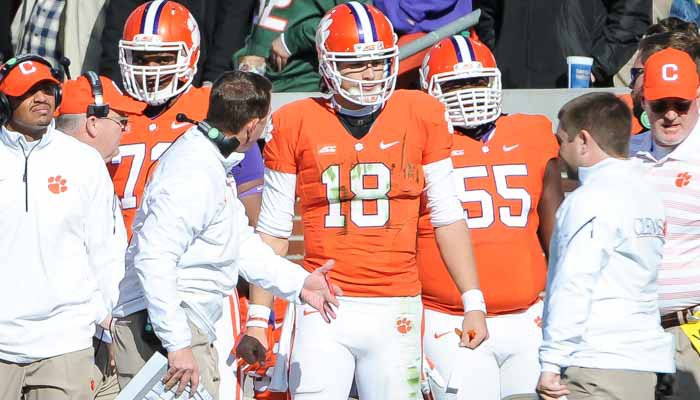 Swinney talks to Stoudt after throwing his third interception of the day.