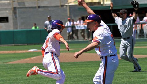 Clemson head coach Jack Leggett waves Chris Okey home