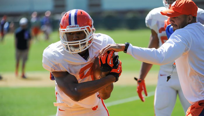 Wayne Gallman and Tony Elliott working on ball security.