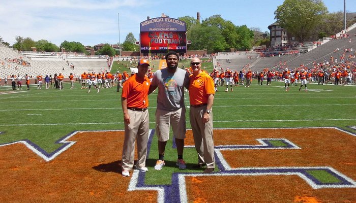 Christian Wilkins poses with Clemson head coach Dabo Swinney and Clemson President James Clements