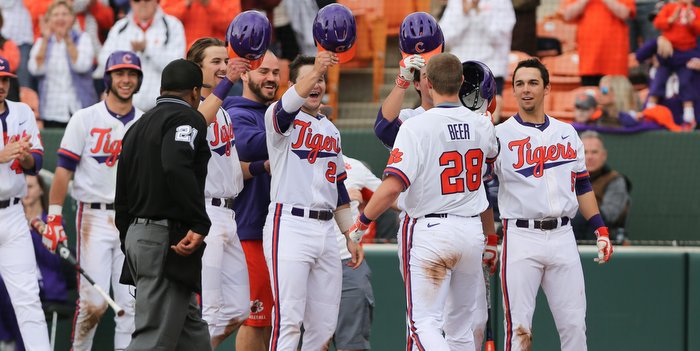 Beer is congratulated after his grand slam Sunday