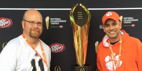 Bays and his friend Bart Foley pose with the championship trophy