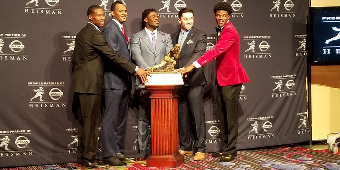 The five finalists take a photo with the trophy