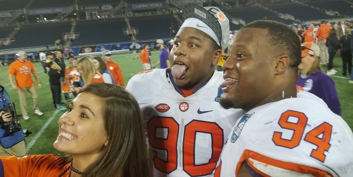 Dexter Lawrence and Carlos Watkins ham it up with Ashley Spiers