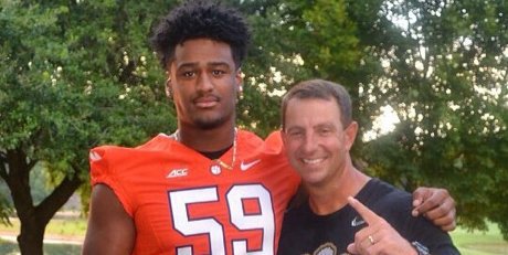 Williams poses with head coach Dabo Swinney in July