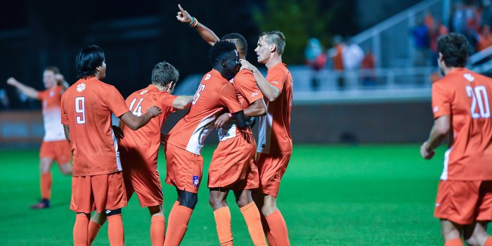 The team celebrates with Happi after his goal (Photo by Carl Ackerman)
