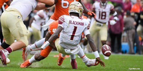 FSU quarterback James Blackman gets blasted by Tre Lamar.