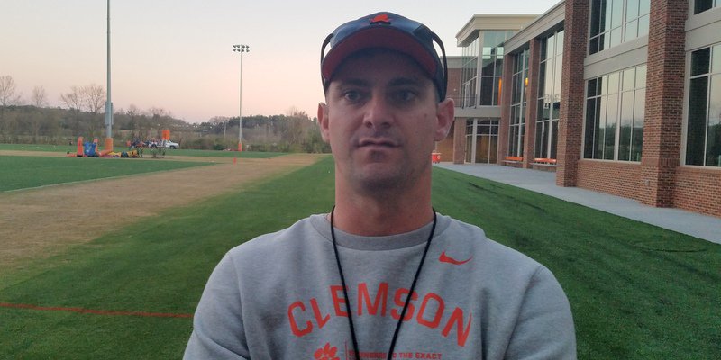 Jeff Scott talks to the media after Friday's practice