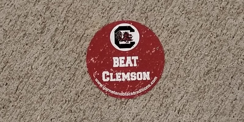 This sticker was stuck to the sidewalk outside the stadium