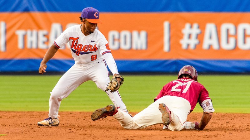 Jordan Greene applies a tag early against FSU (Photo by David Grooms)
