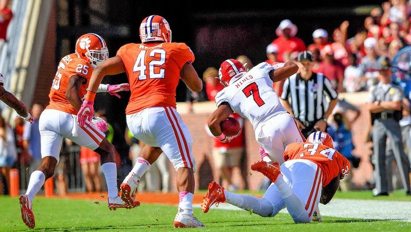 The Tigers chase down a Pack ball carrier two years ago