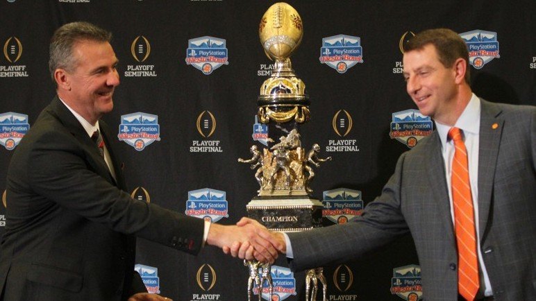Swinney and Urban Meyer shake hands before the Fiesta Bowl