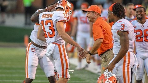 Renfrow (13) gets a big smile from Swinney after punting Saturday