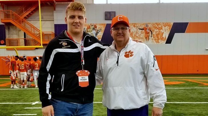 Putnam poses with offensive line coach Robbie Caldwell