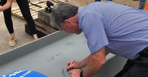 Athletic Director Dan Radakovich signs the last beam on Clemson's softball stadium