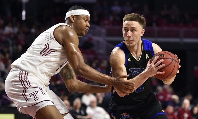Scott (right) drives the ball last season for Tulsa