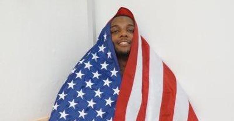 Simms wears the flag after the gold medal win