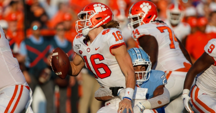 Lawrence is smacked by a UNC defender Saturday (Photo by Neil Redmond, USAT)