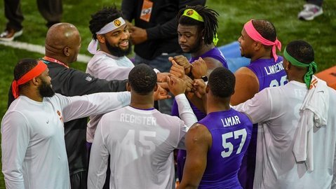 Members of the Power Rangers speak with former coach Marion Hobby