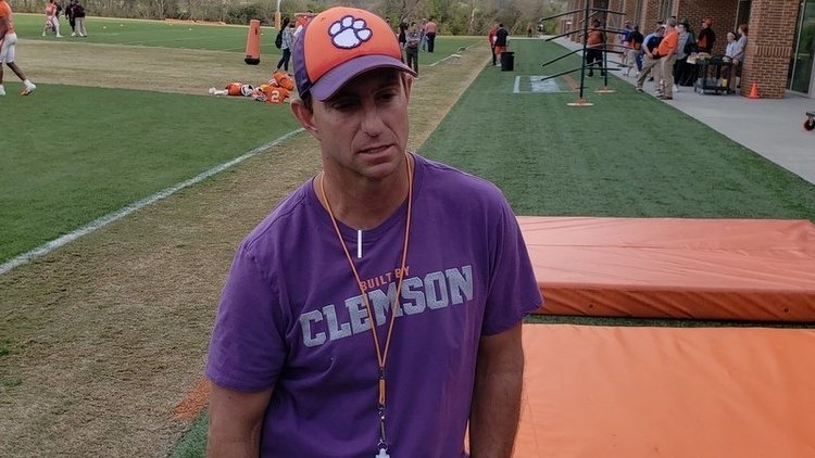 Swinney talks to the media after Friday's practice