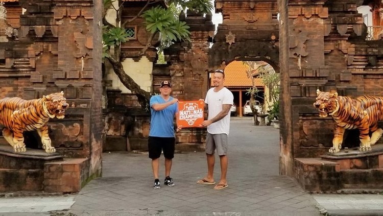 Showing off the Clemson flag at a temple in Bali