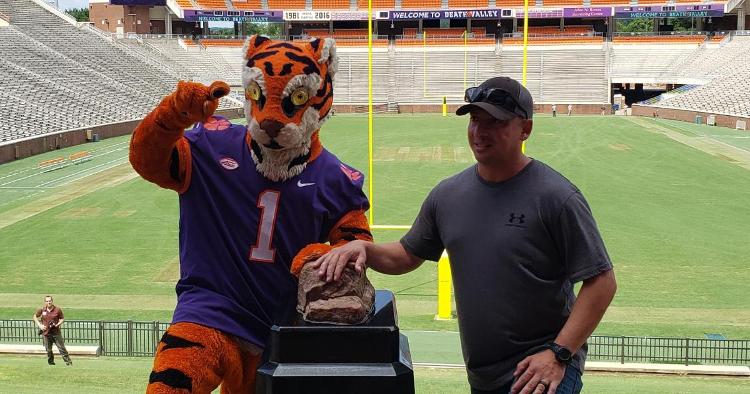 The Tiger poses with a veteran at Howard's Rock Thursday