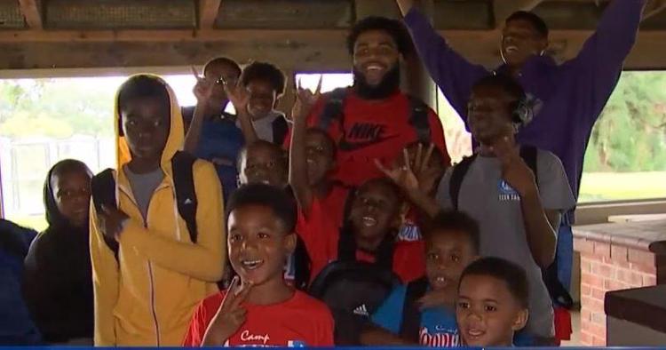 WATCH: Christian Wilkins gives backpacks to kids