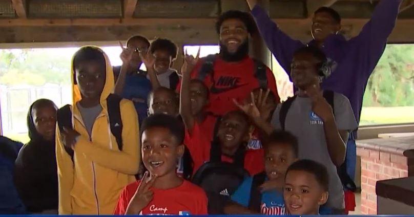 WATCH: Christian Wilkins gives backpacks to kids
