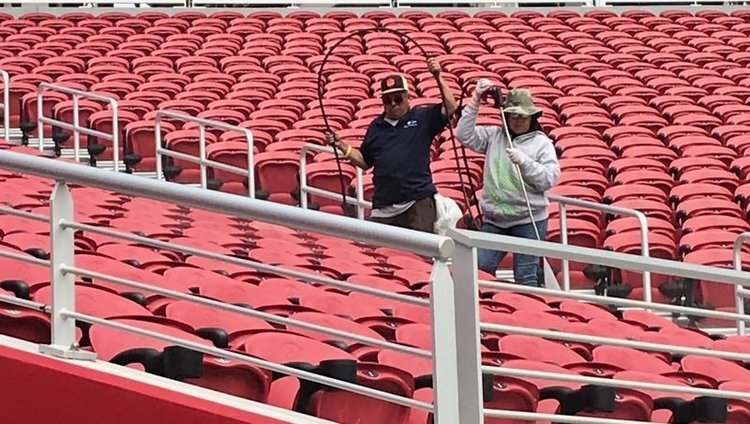 The famous photo from last May shows a worker wearing a Clemson hat