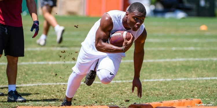 Adams runs through drills at Swinney's camp