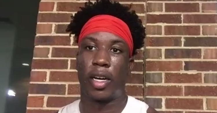 KJ Henry speaks with the media Monday evening.