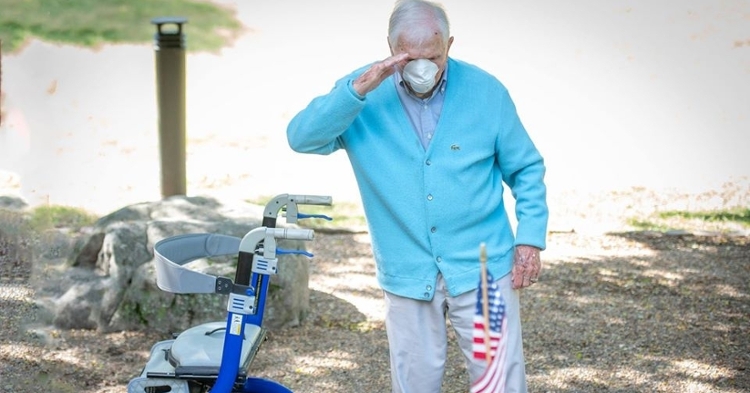 Colonel Ben Skardon salutes the placing of the flag at Henry Leitner's grave. (Photo courtesy of Ken Scar)