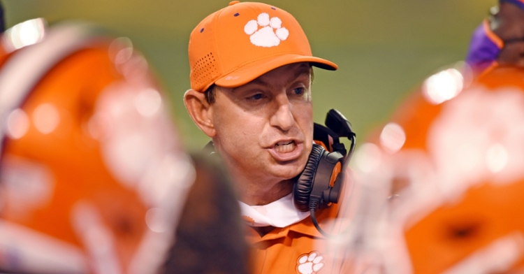Swinney talks to his players on the sidelines Saturday night at Wake, (Photo per ACC)