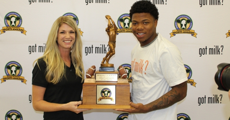 Florida Dairy Farmers representative Brittney Thurlow with 2019 Florida Mr. Football Demarkcus Bowman