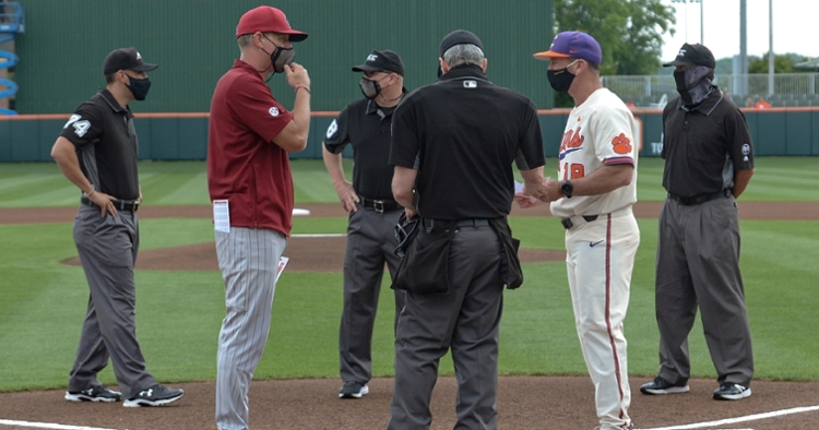 The two coaches meet at home plate before Tuesday's game. (Photo by Ken Ruinard)