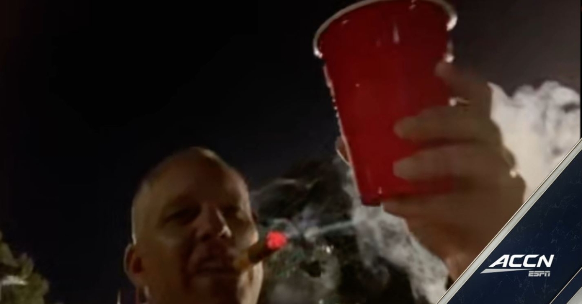 LOOK: Dave Doeren celebrates beating Clemson by smoking cigar on television