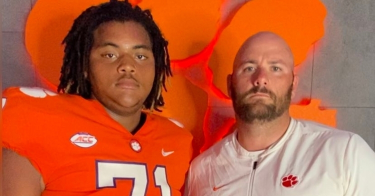 Miller (left) poses with Thomas Austin earlier this year.