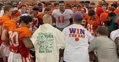 Ella spending time with the Clemson footbal team (Photo courtesy: Ashley Spiers)